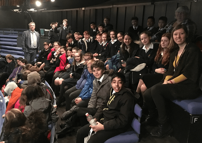 Group of Leighton Park pupils sitting in auditorium seats