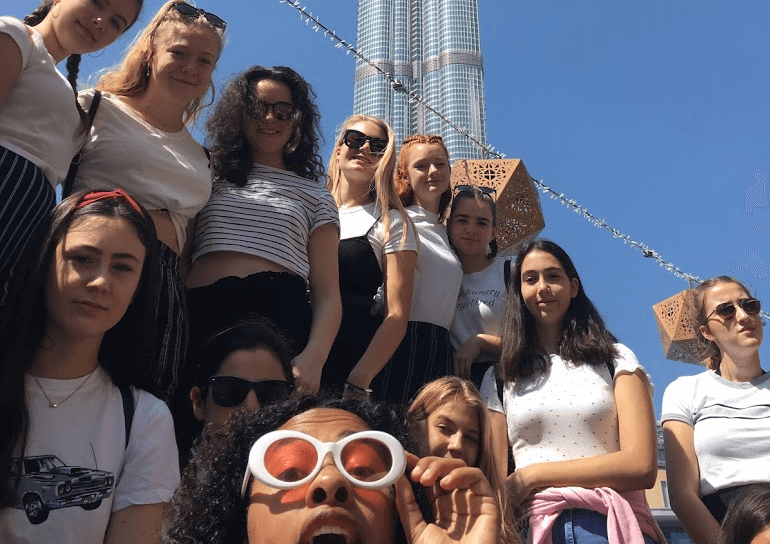 Group of female Leighton Park pupils in front of Burj Khalifa in Dubai